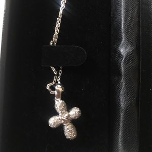 Diamonds and gold cross necklace